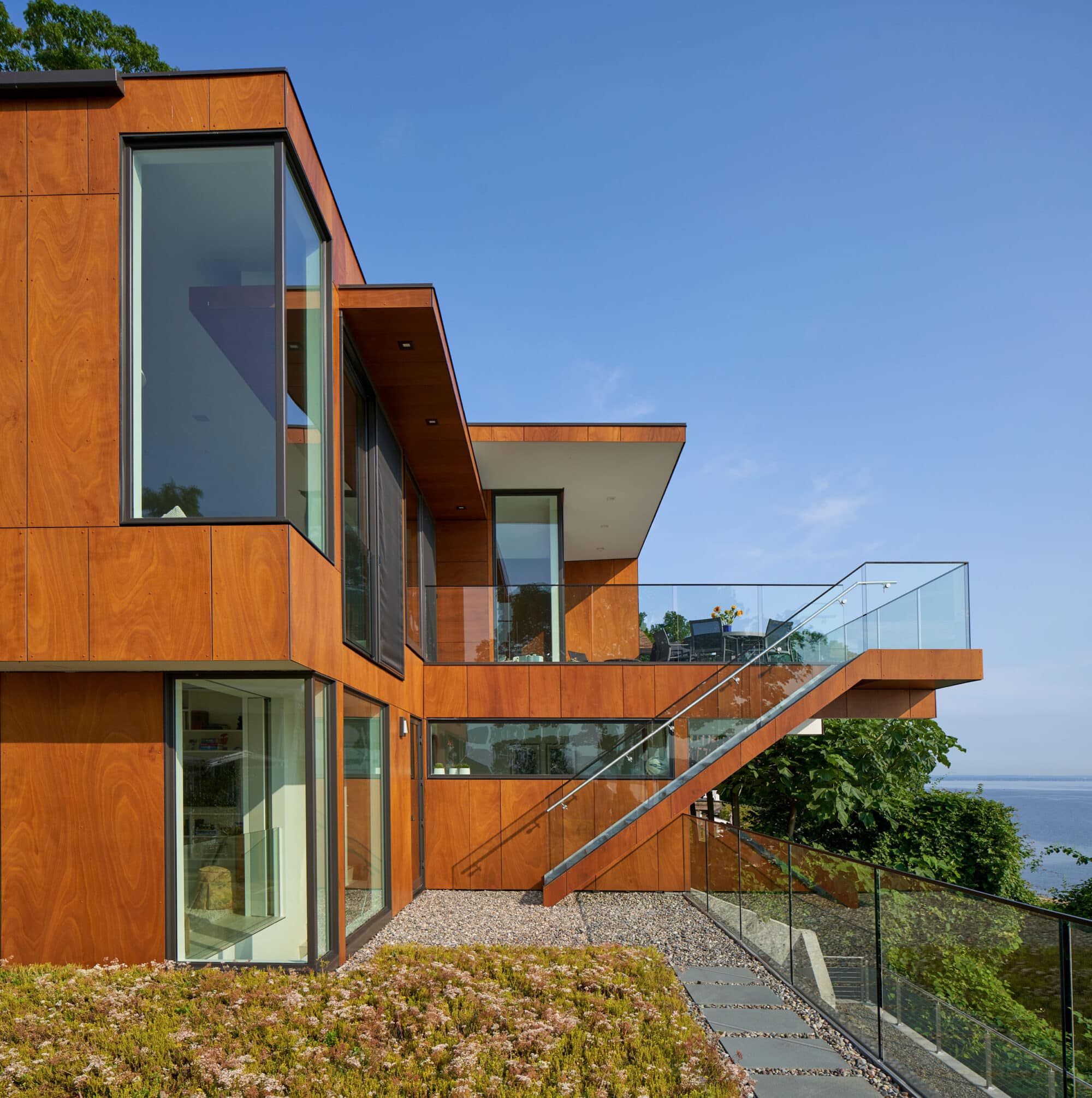 Natural timber cladding and interior panelling at Cliffside Residence 03