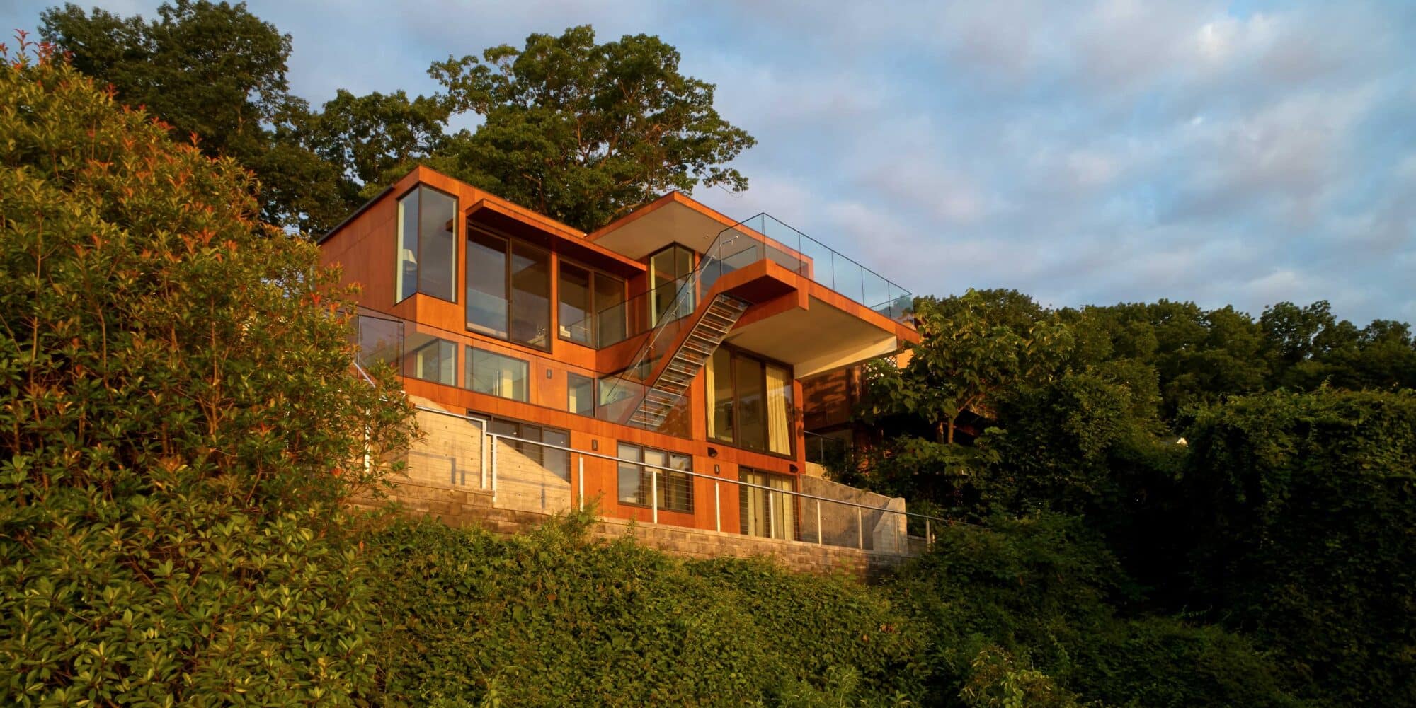 Natural timber cladding and interior panelling at Cliffside Residence 01