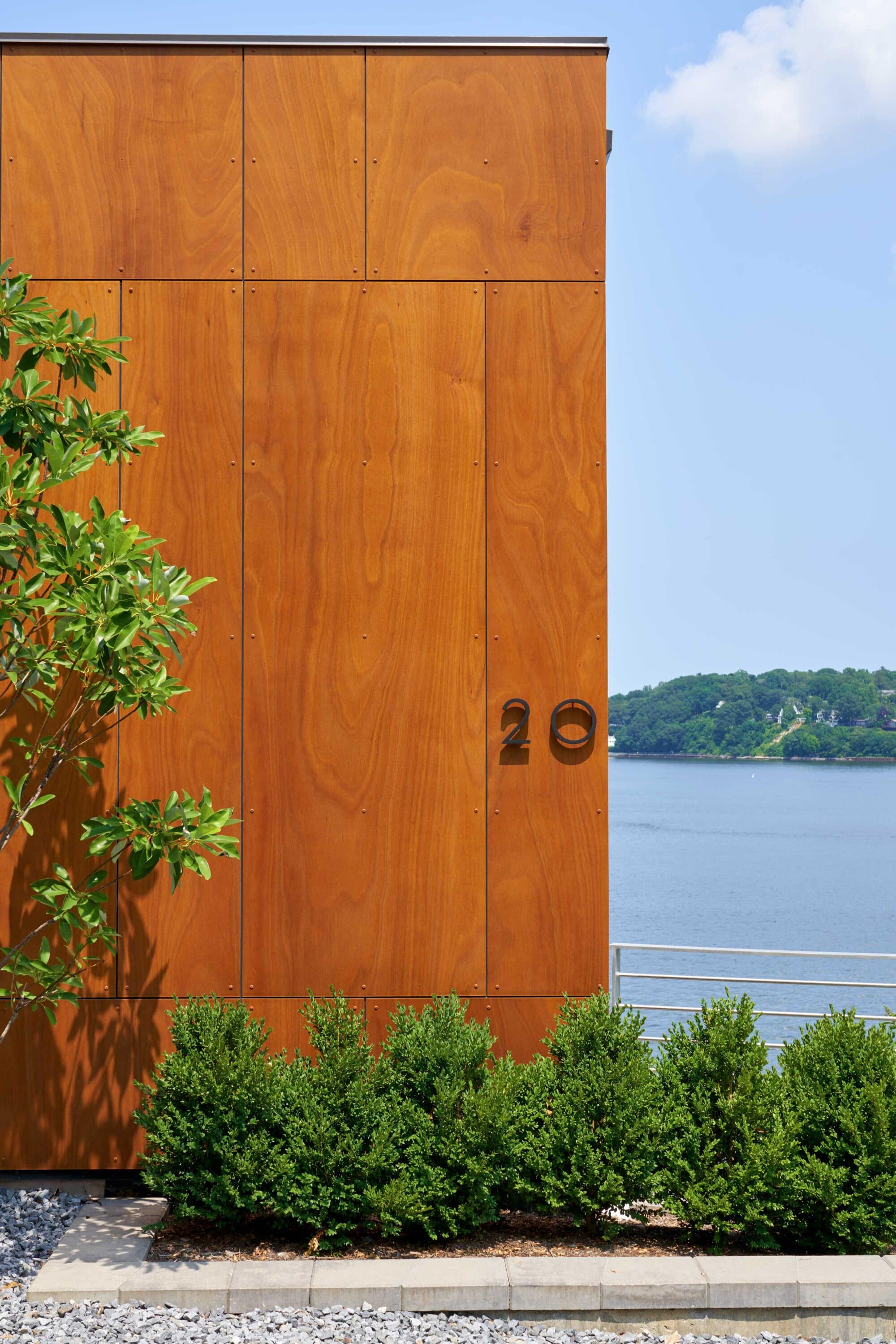 Natural timber cladding and interior panelling at Cliffside Residence 02