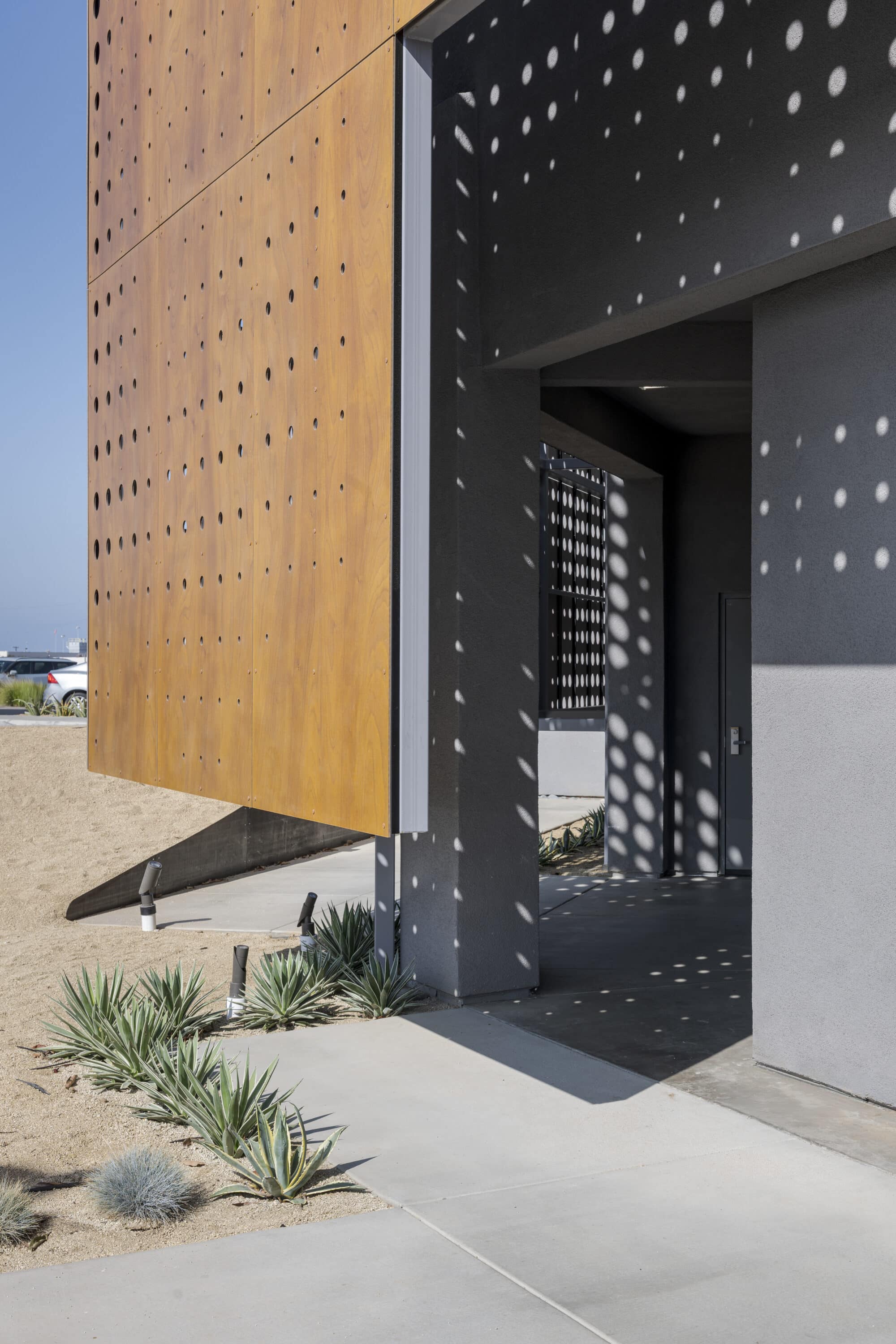 Perforated wood facade in Sessions by the Bay 05