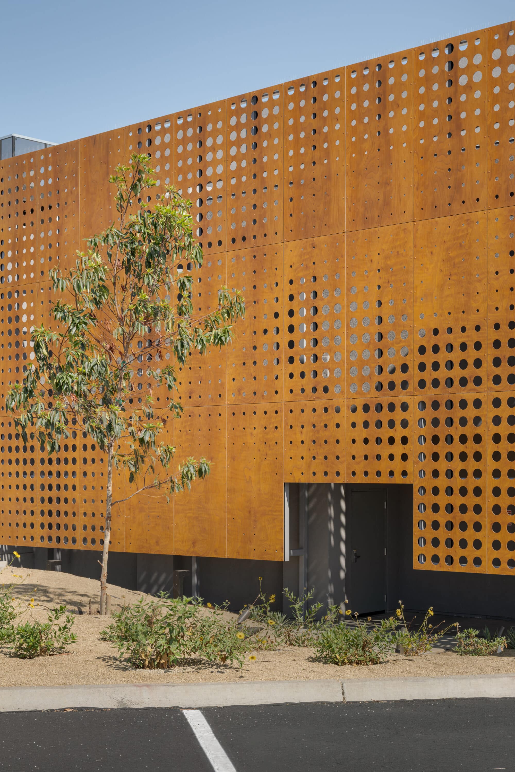Perforated wood facade in Sessions by the Bay 02